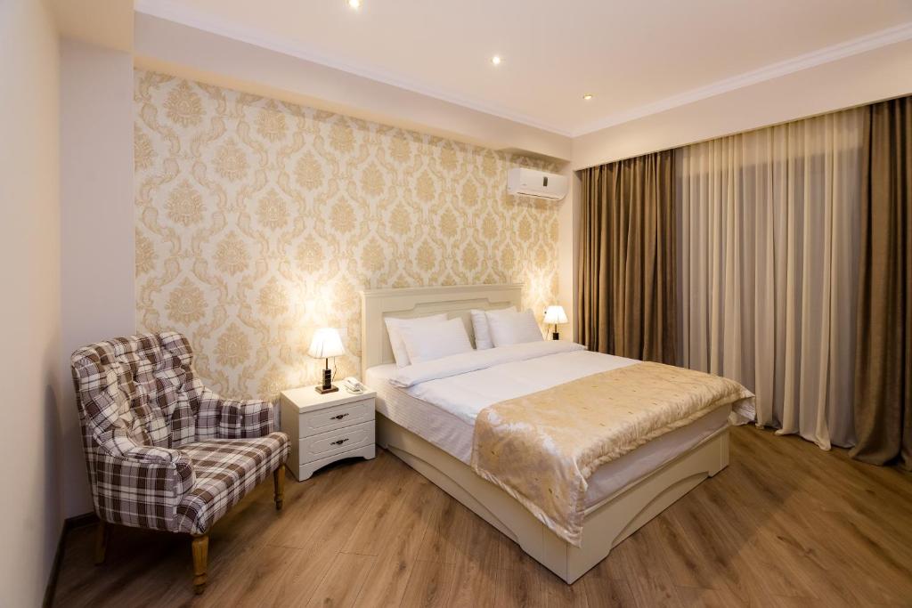 Postel nebo postele na pokoji v ubytování Orchid Boutique Hotel