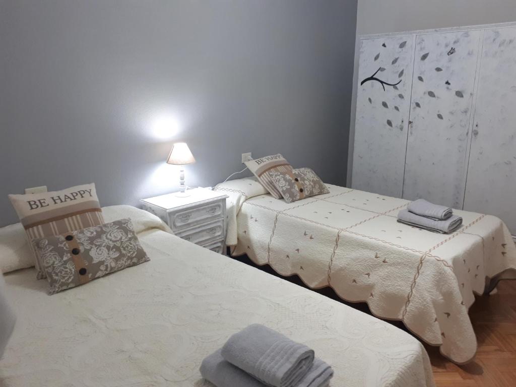 A bed or beds in a room at Piso Camino de Santiago 2