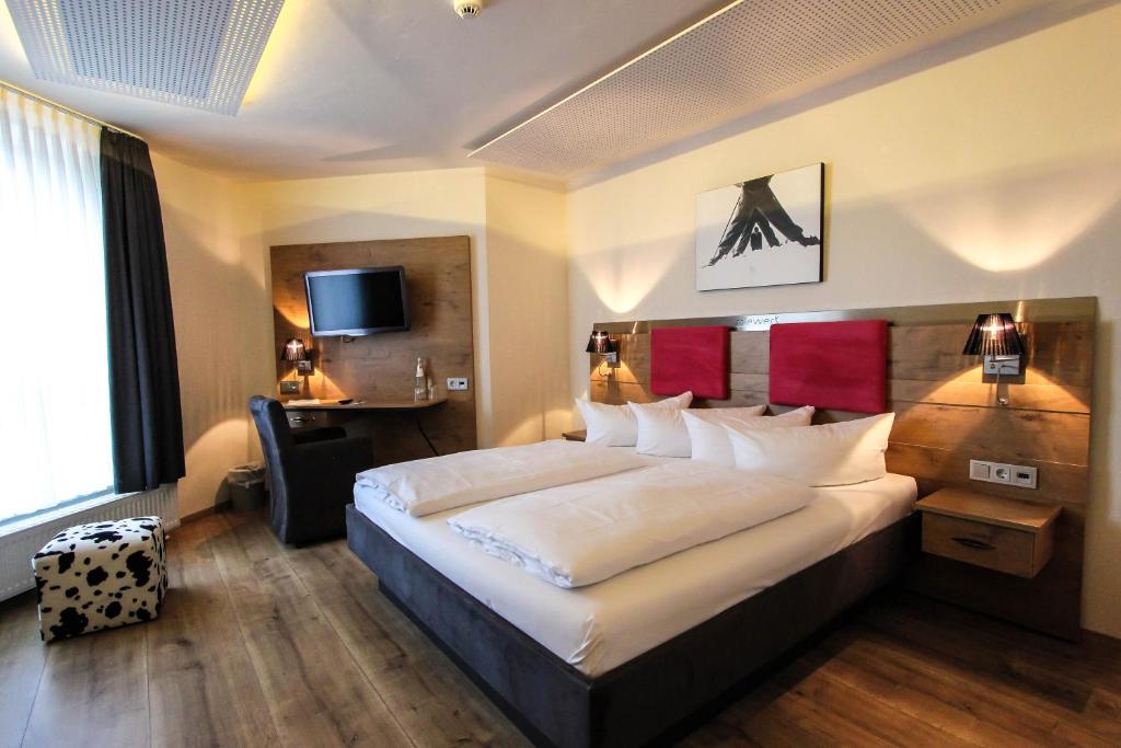 Postel nebo postele na pokoji v ubytování SOLEWERK Hotel