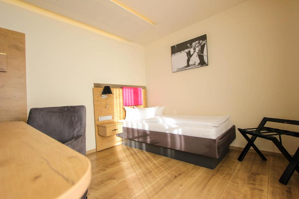 Postel nebo postele na pokoji v ubytování SOLEWERK Hotel