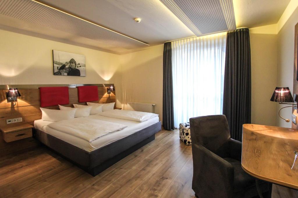 Postel nebo postele na pokoji v ubytování SOLEWERK Hotel