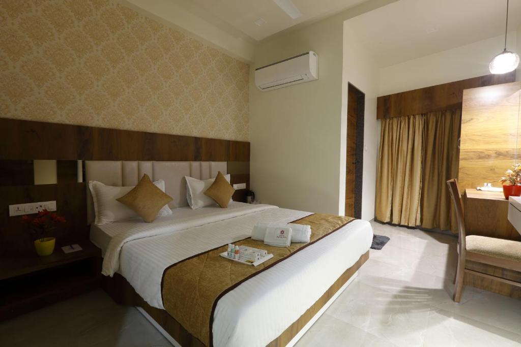 Postel nebo postele na pokoji v ubytování Hotel Alka Inn