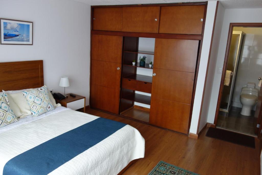 Postel nebo postele na pokoji v ubytování Hotel Maceo Chico