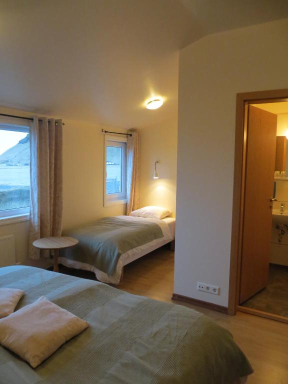 Postel nebo postele na pokoji v ubytování Guesthouse Vellir