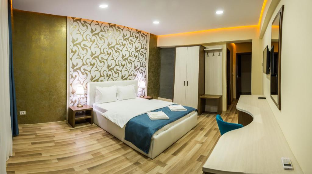 Postel nebo postele na pokoji v ubytování Monopoly Hotel