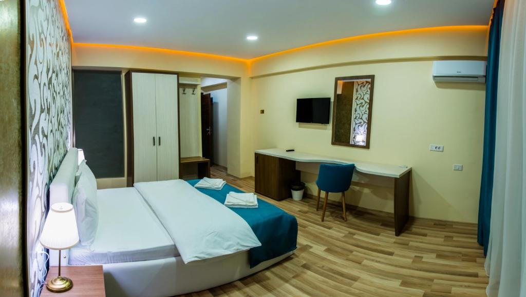 Postel nebo postele na pokoji v ubytování Monopoly Hotel
