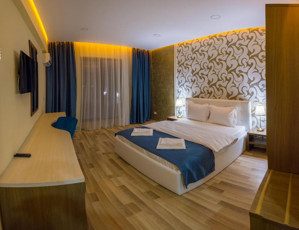 Postel nebo postele na pokoji v ubytování Monopoly Hotel