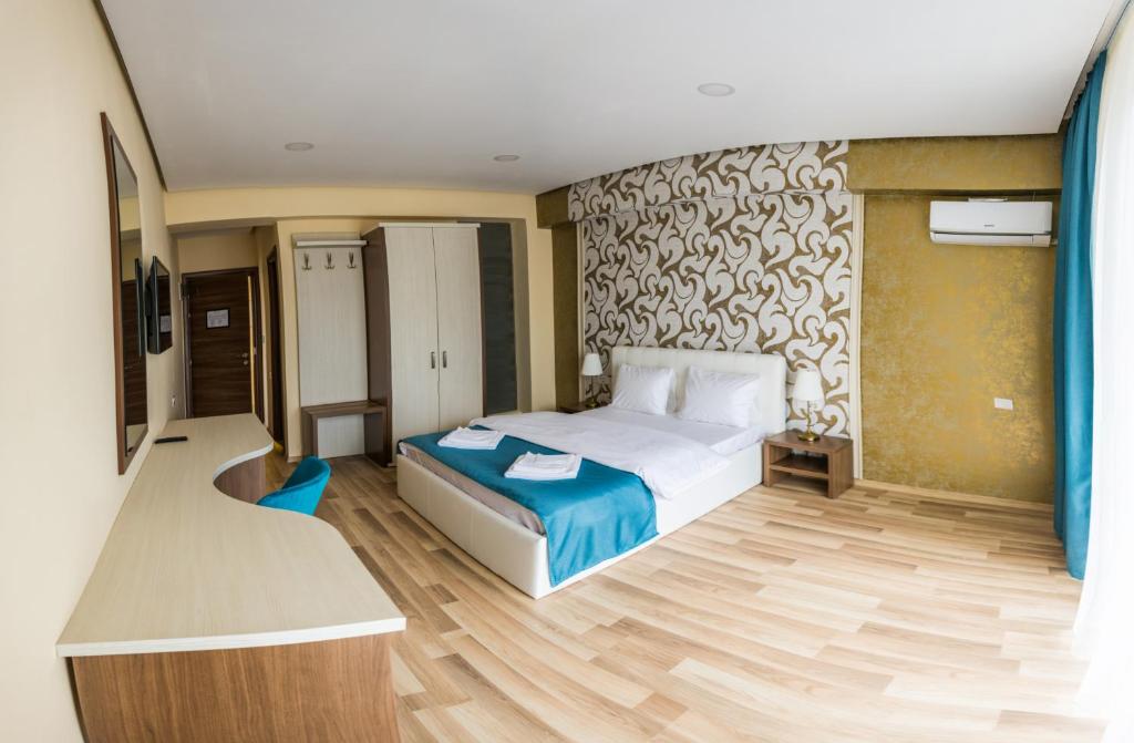 Postel nebo postele na pokoji v ubytování Monopoly Hotel