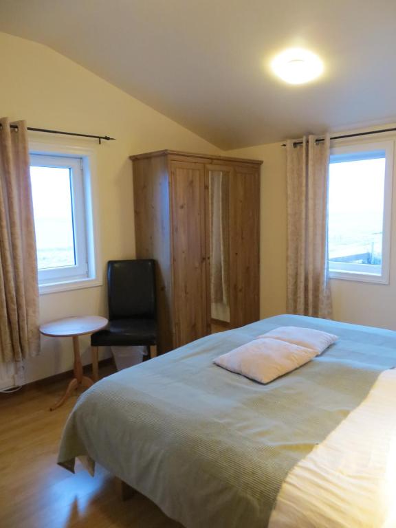 Postel nebo postele na pokoji v ubytování Guesthouse Vellir