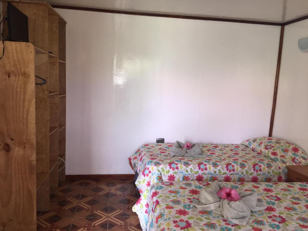 Voodi või voodid majutusasutuse Cabanas Hinariru Nui toas