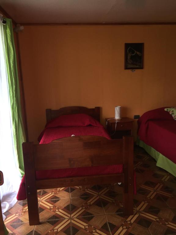Voodi või voodid majutusasutuse Cabanas Hinariru Nui toas