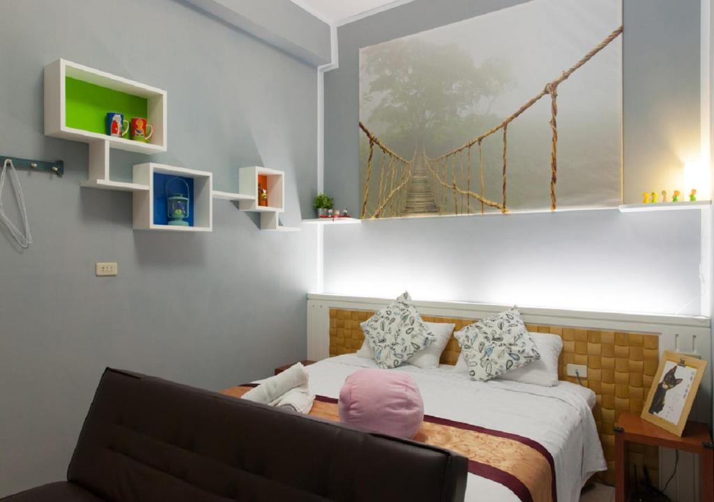 a bedroom with a bed with a bridge on the wall at Wish Dream in Donggang