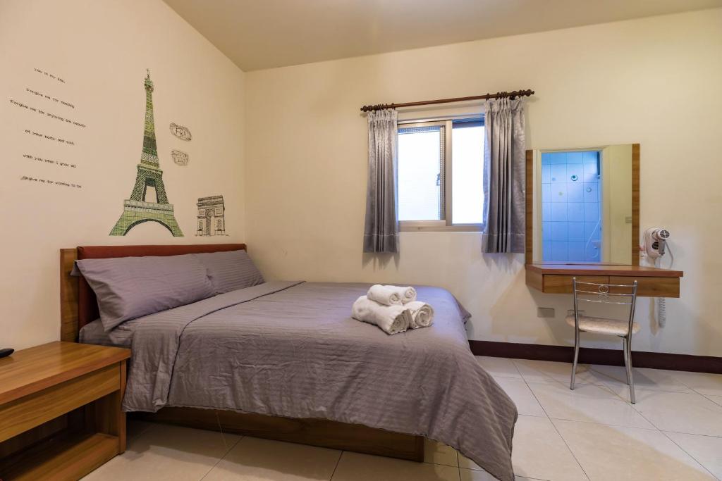 Postel nebo postele na pokoji v ubytování Jia Xiang Lin Guan Hai Homestay