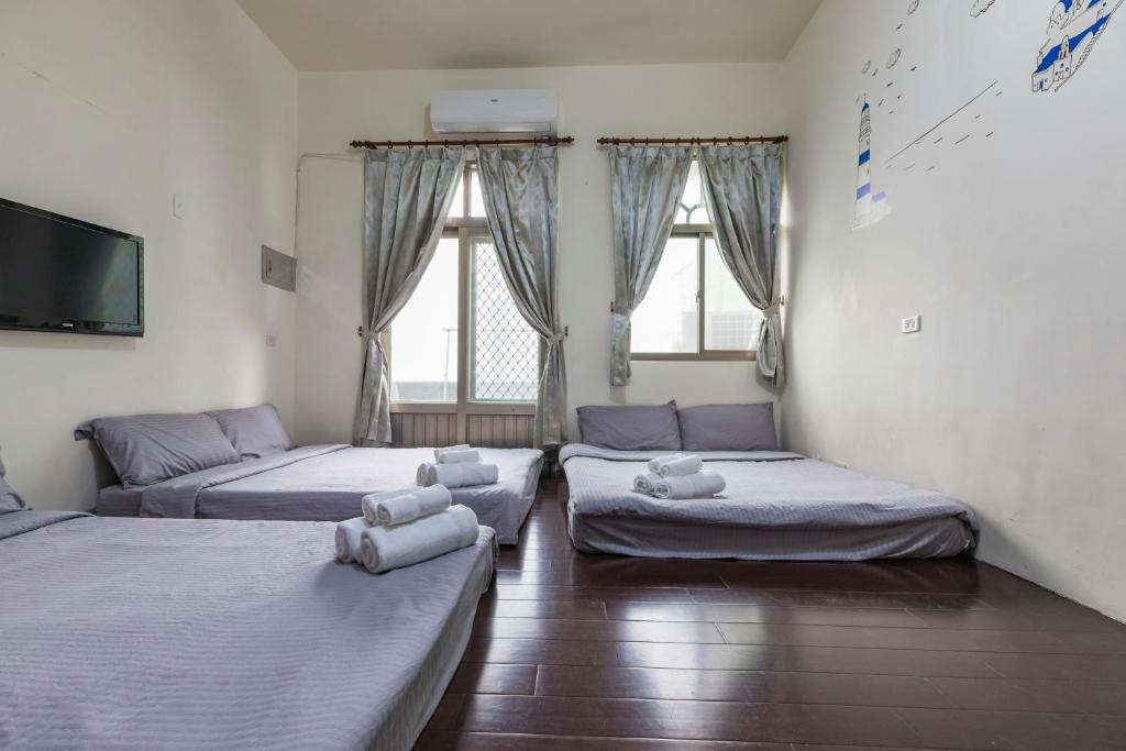 Postel nebo postele na pokoji v ubytování Jia Xiang Lin Guan Hai Homestay