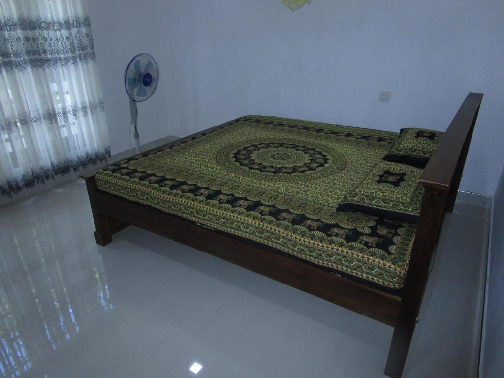 Postel nebo postele na pokoji v ubytování Maneesha Guest House