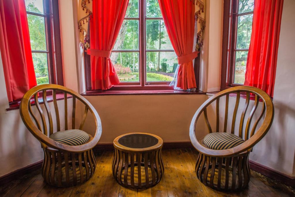 Posezení v ubytování Royal Majesty Bungalow