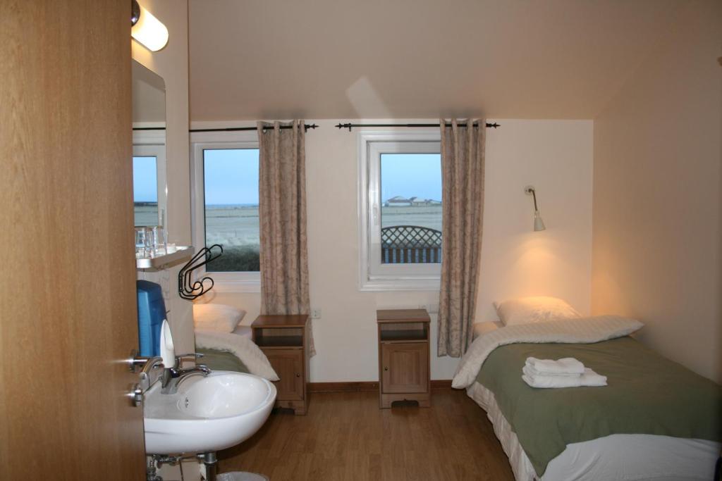 Postel nebo postele na pokoji v ubytování Guesthouse Vellir
