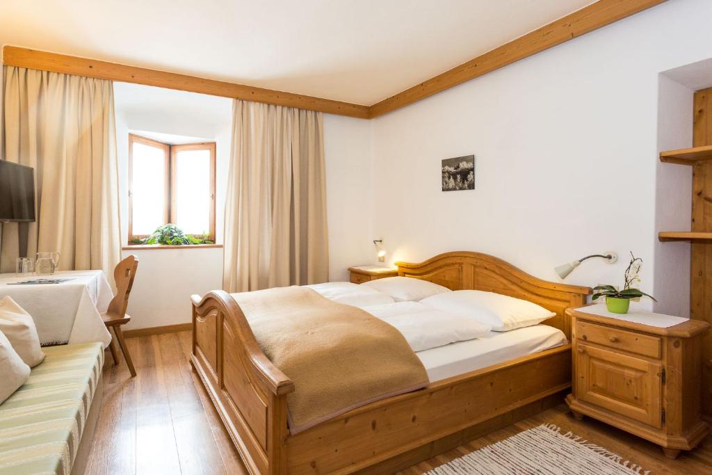 Postel nebo postele na pokoji v ubytování Garni Zatzerhof