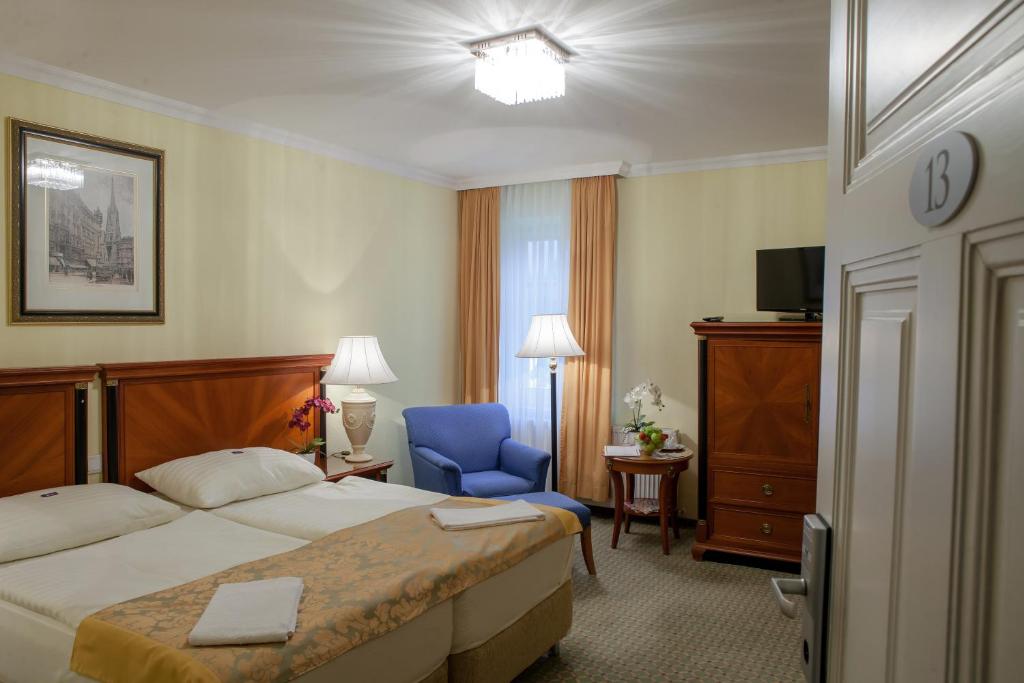 Postel nebo postele na pokoji v ubytování Hotel Villa Huber