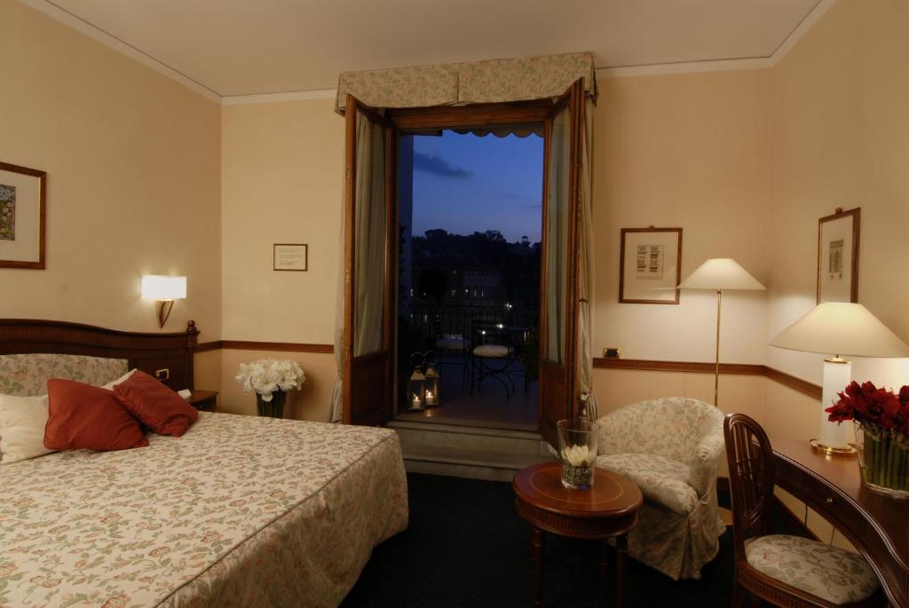 Postel nebo postele na pokoji v ubytování Hotel degli Orafi