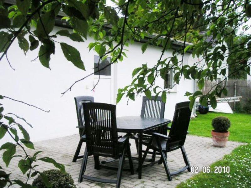 a table and chairs sitting on a patio at FH Charlottchen_WEIG in Ostseebad Karlshagen