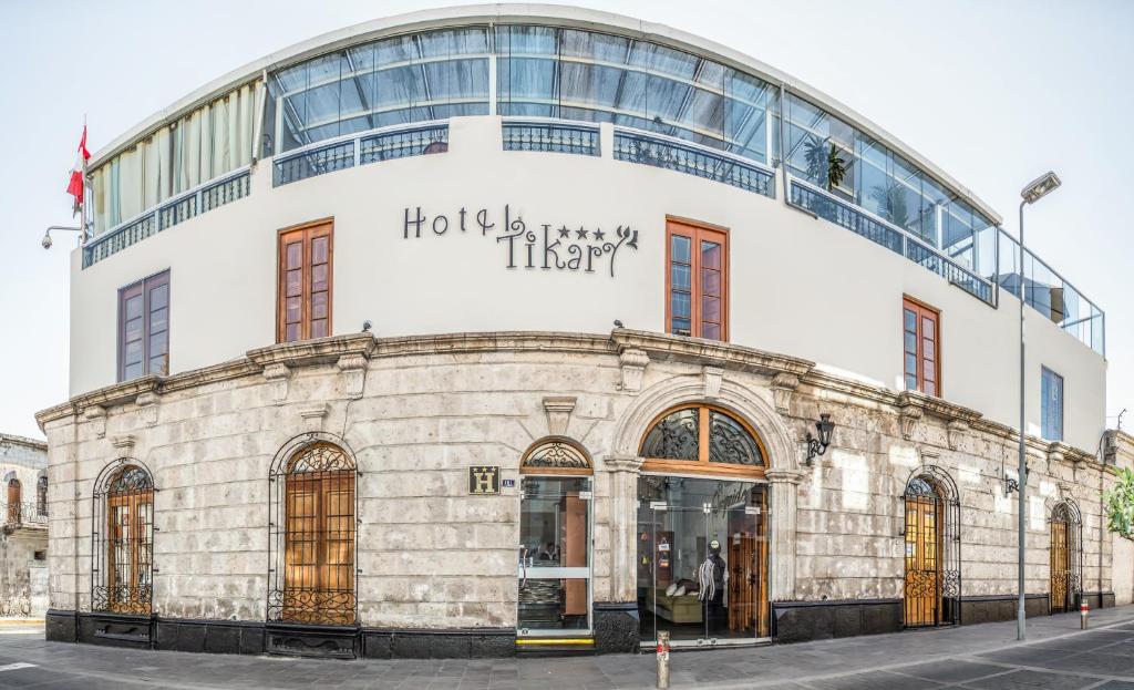 a building with a sign that reads hotel harley harley at Hotel Tikary in Arequipa