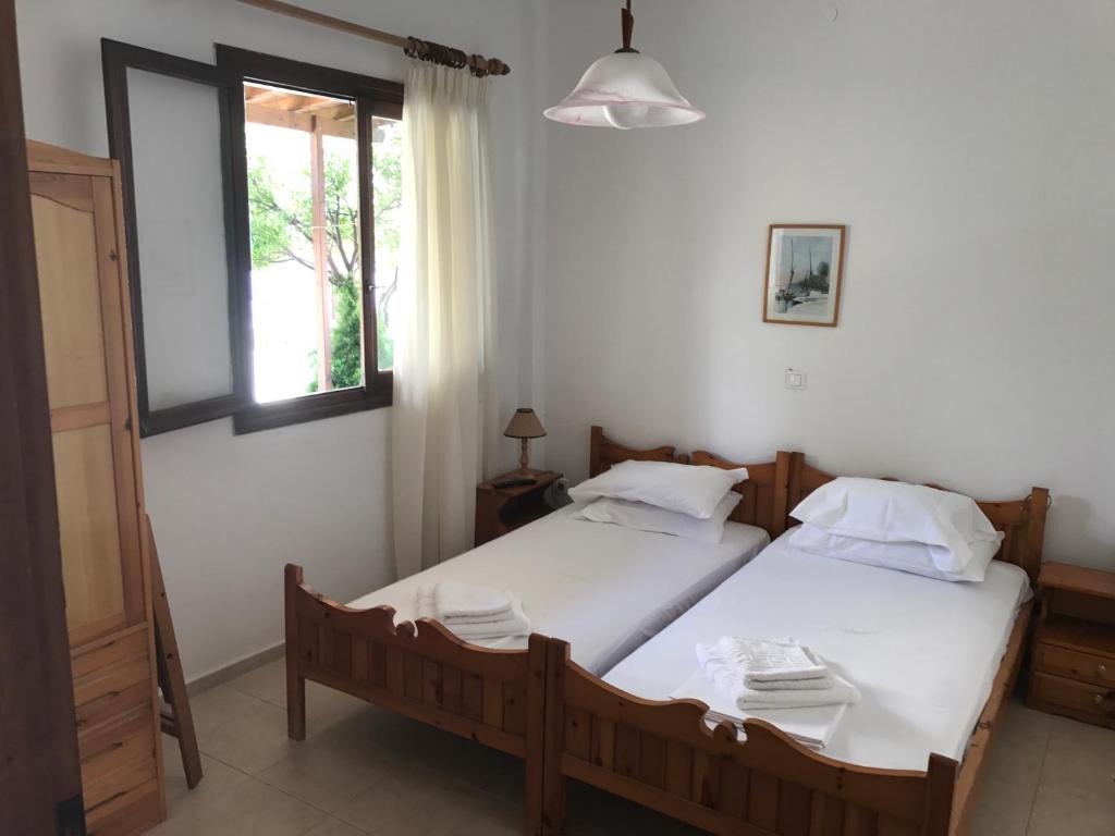 Postel nebo postele na pokoji v ubytování Akti Rooms And Studios