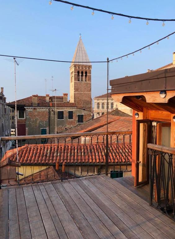 a wooden deck with a view of a building at KEY LOCATION near Palazzo Grassi in Venice