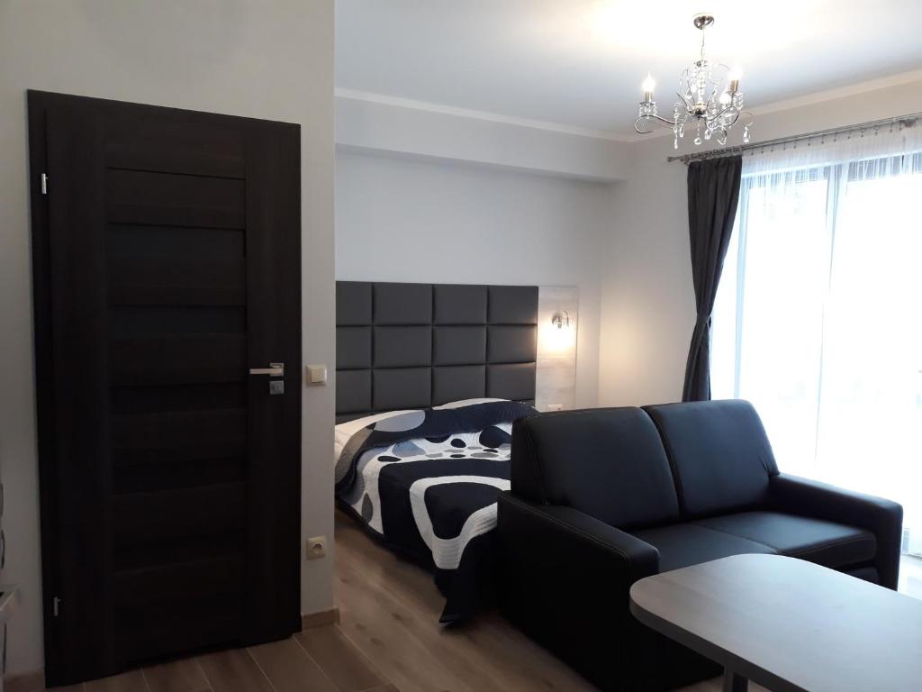 Posteľ alebo postele v izbe v ubytovaní Apartamenty Pod Skrzycznem