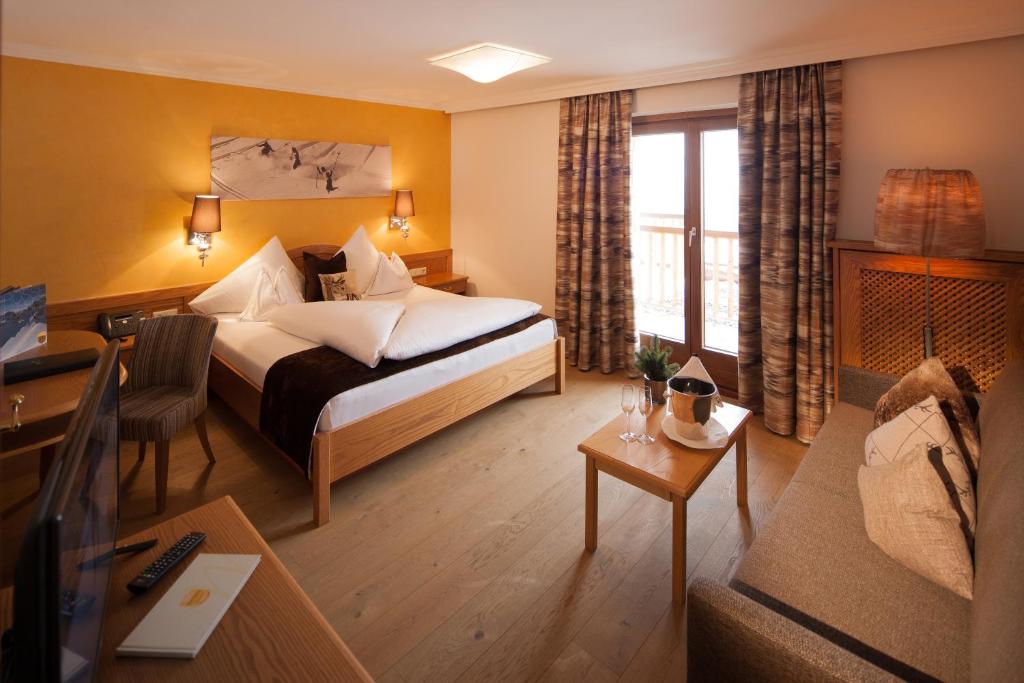 Postel nebo postele na pokoji v ubytování Hotel & Chalet Montana