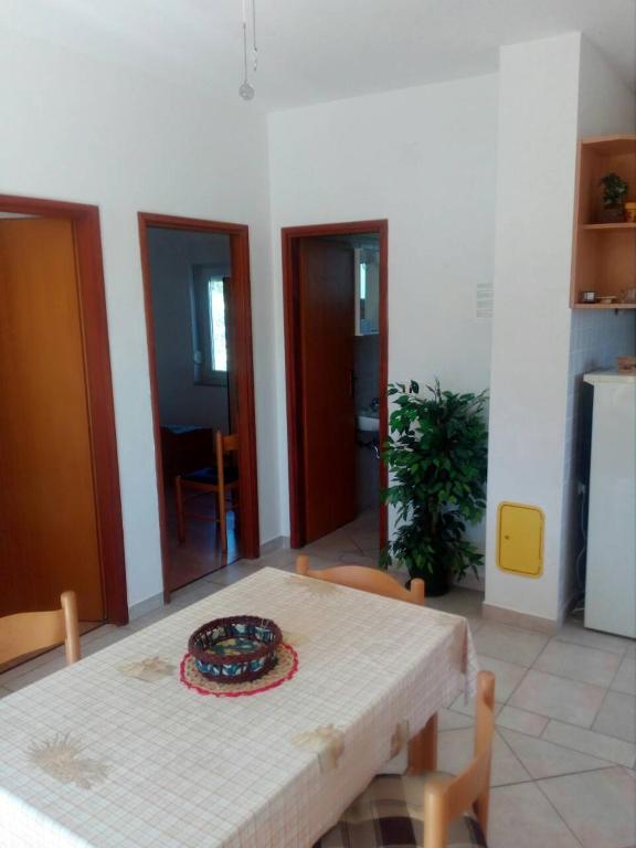 a room with a table with a plate on it at Apartments Irena in Božava