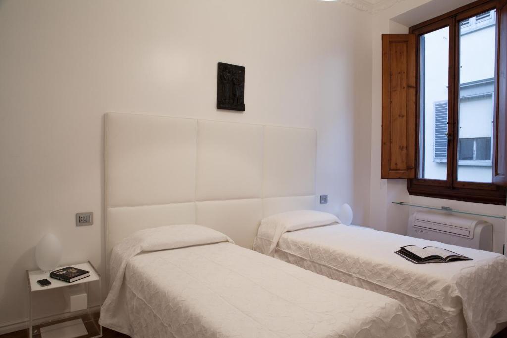Posteľ alebo postele v izbe v ubytovaní Suite Deluxe Florence