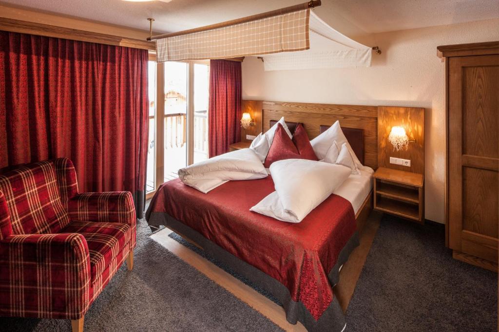 Postel nebo postele na pokoji v ubytování Hotel & Chalet Montana