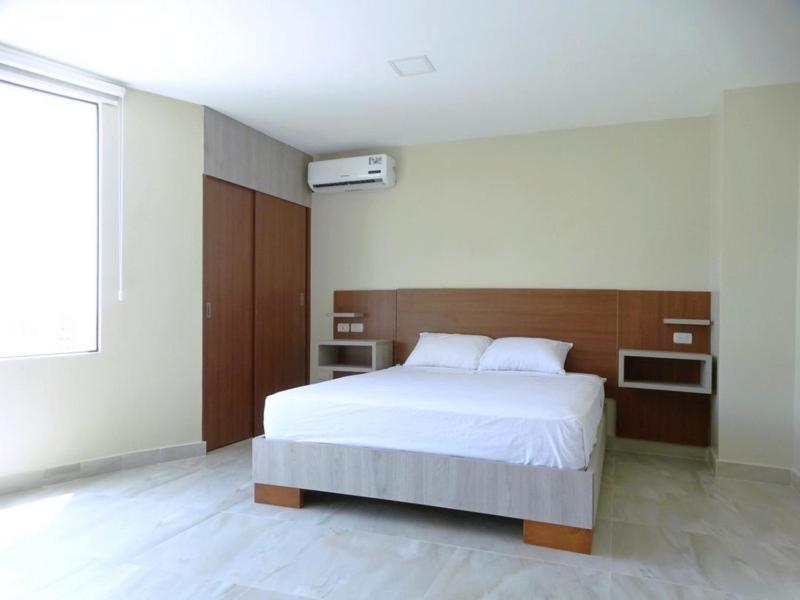 Postel nebo postele na pokoji v ubytování Hotel Marvento II
