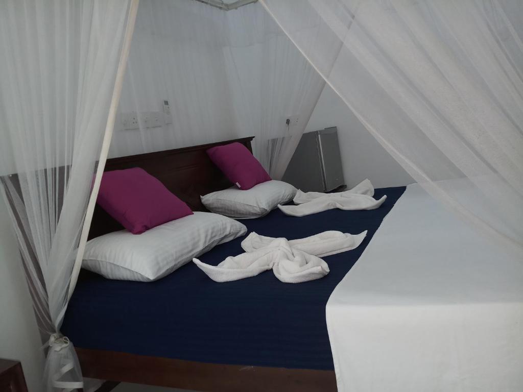 Postel nebo postele na pokoji v ubytování Turtle Bay Beach Resort