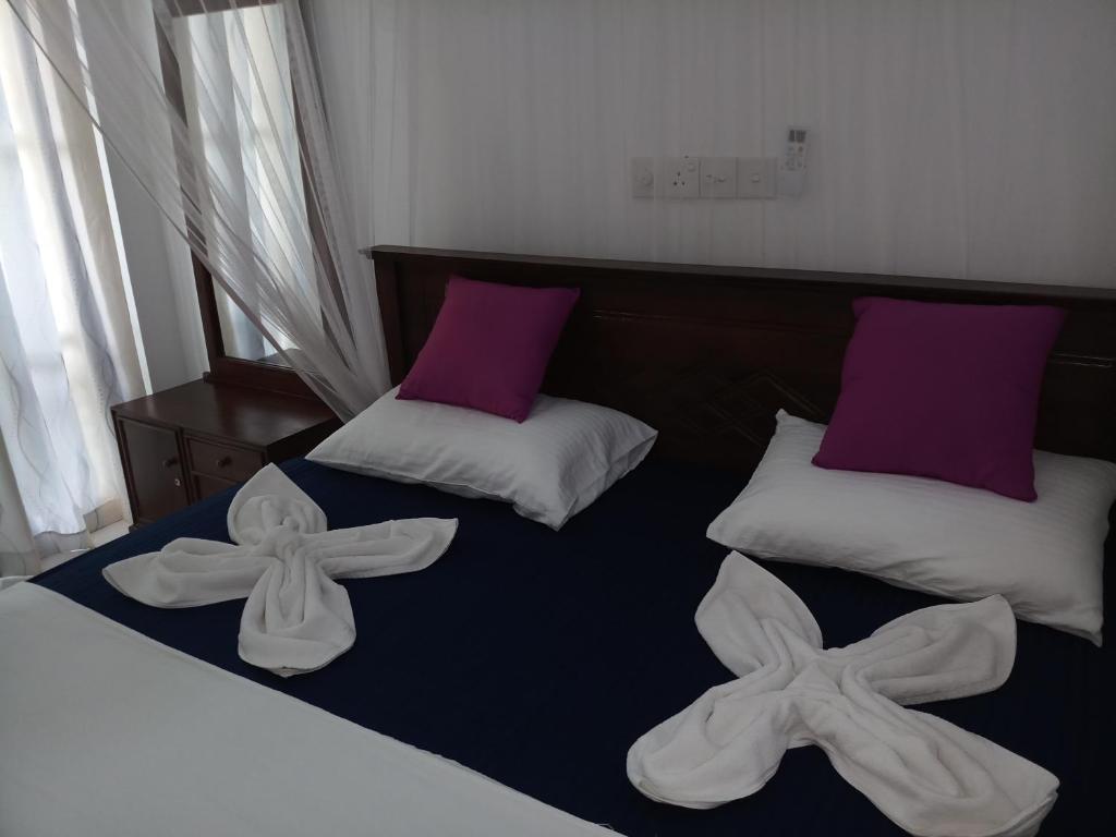 Postel nebo postele na pokoji v ubytování Turtle Bay Beach Resort