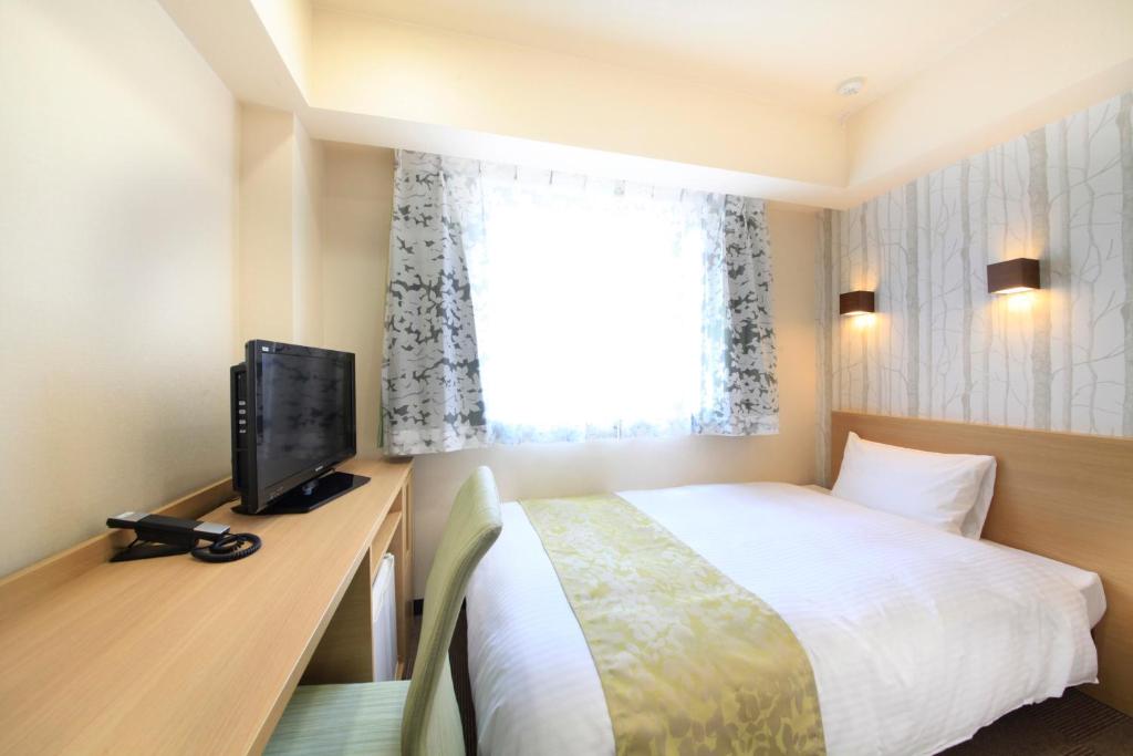 TV a/nebo společenská místnost v ubytování Hotel Lifetree Hitachinoushiku