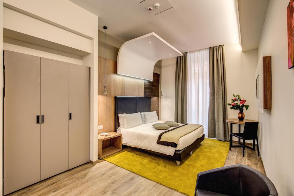 Postel nebo postele na pokoji v ubytování Trevi Collection Hotel - Gruppo Trevi Hotels