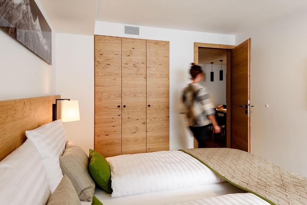 Postel nebo postele na pokoji v ubytování EVA Serviced Apartments