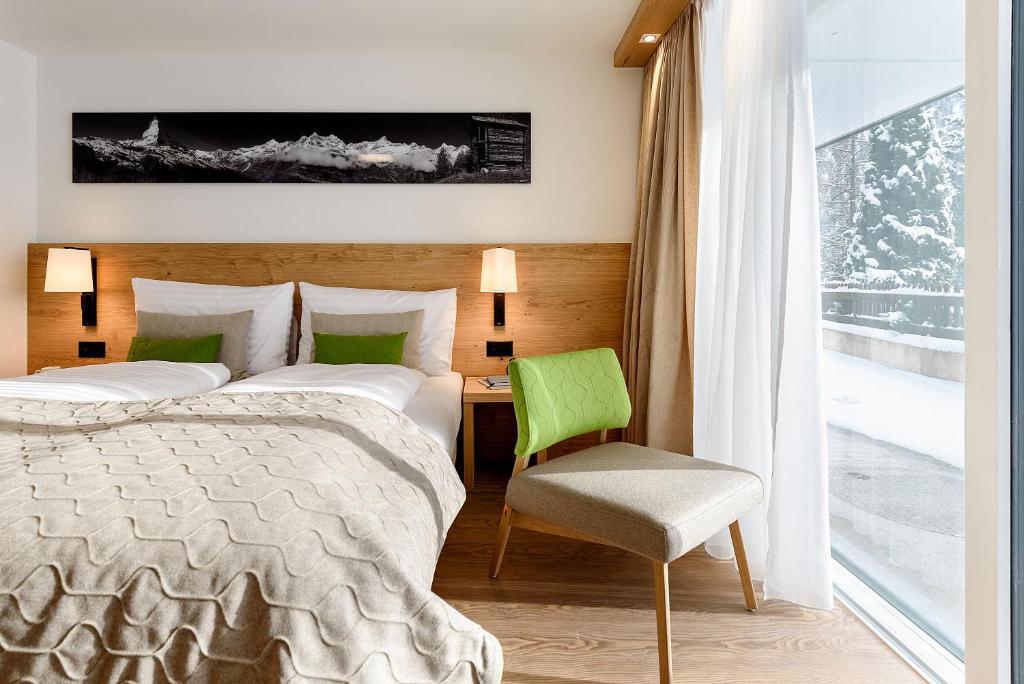 Postel nebo postele na pokoji v ubytování EVA Serviced Apartments
