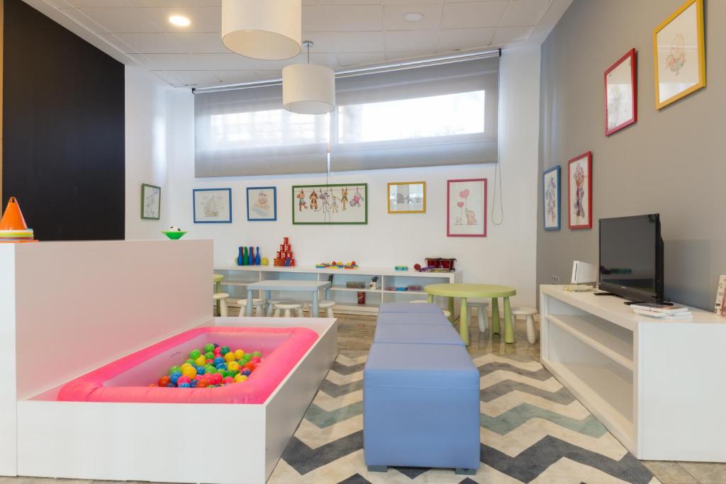 a waiting room with a sandbox with balls in it at Sandos Benidorm Suites in Benidorm