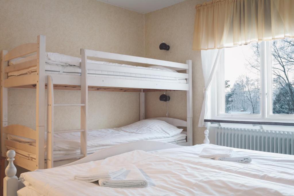 Postel nebo postele na pokoji v ubytování Helsingegården