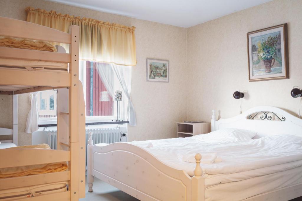 Postel nebo postele na pokoji v ubytování Helsingegården