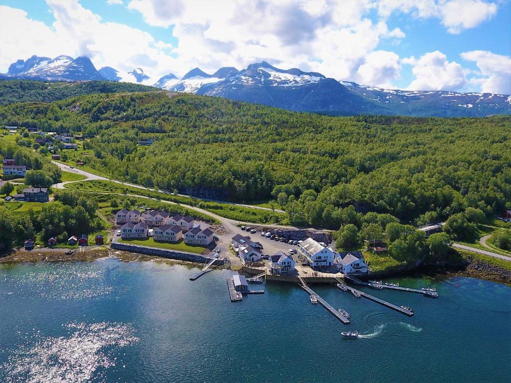 an aerial view of a resort on a lake with mountains at Saltstraumen Brygge in Saltstraumen