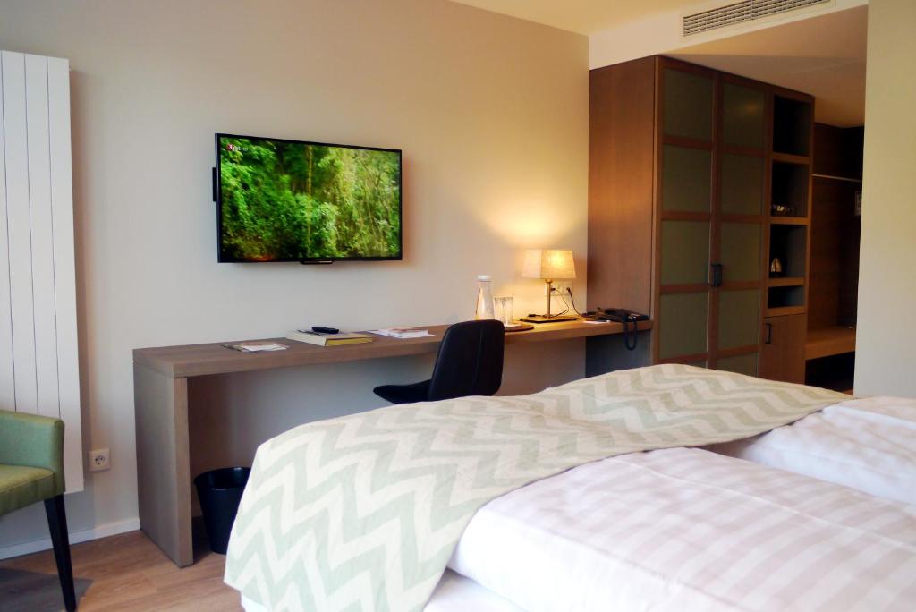 Postel nebo postele na pokoji v ubytování Romantik Hotel Das Lindner