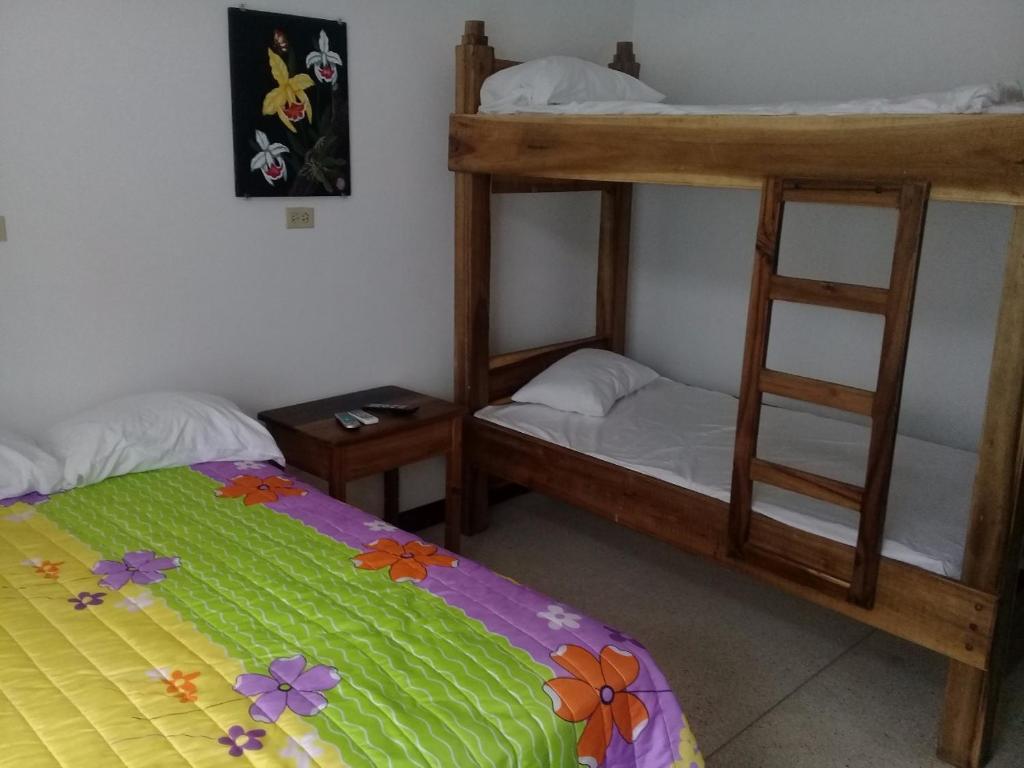 Postel nebo postele na pokoji v ubytování Hostel Quintonido