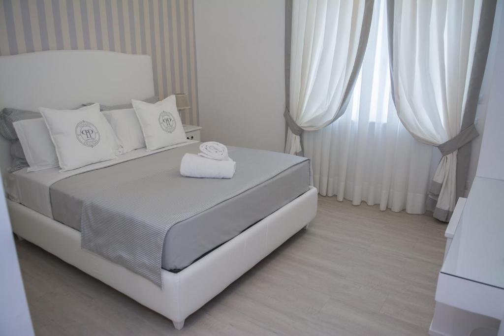 Łóżko lub łóżka w pokoju w obiekcie B&B Pompei Passion