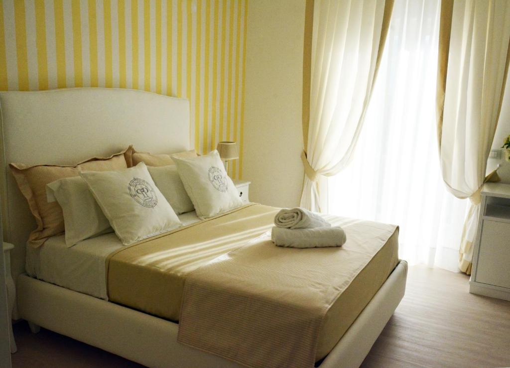 Łóżko lub łóżka w pokoju w obiekcie B&B Pompei Passion