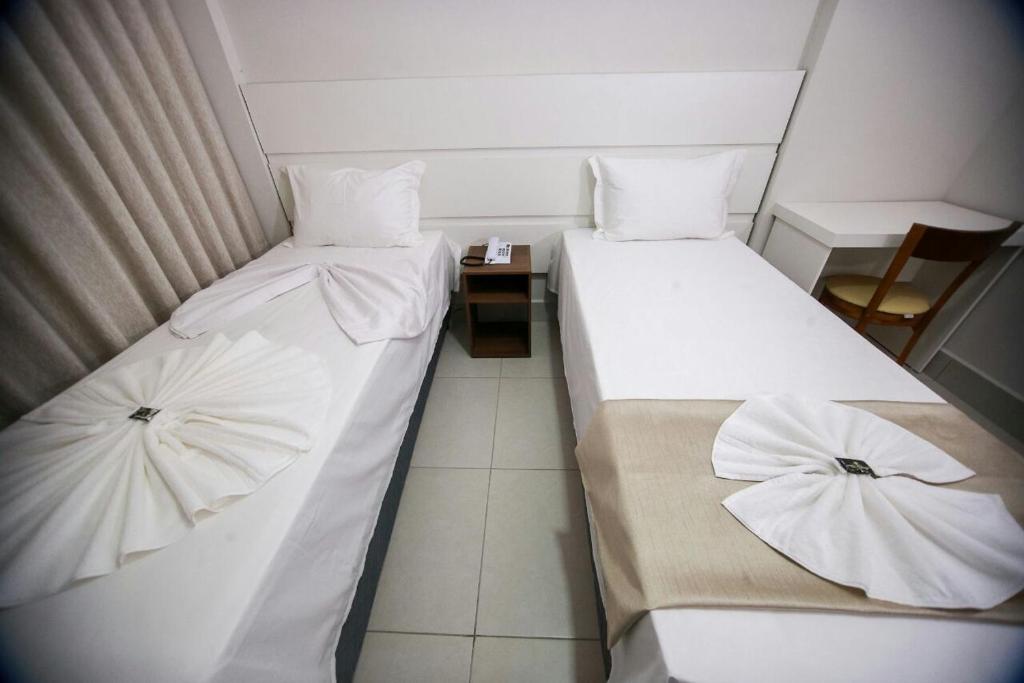 Postel nebo postele na pokoji v ubytování Hotel Portal Guanambi