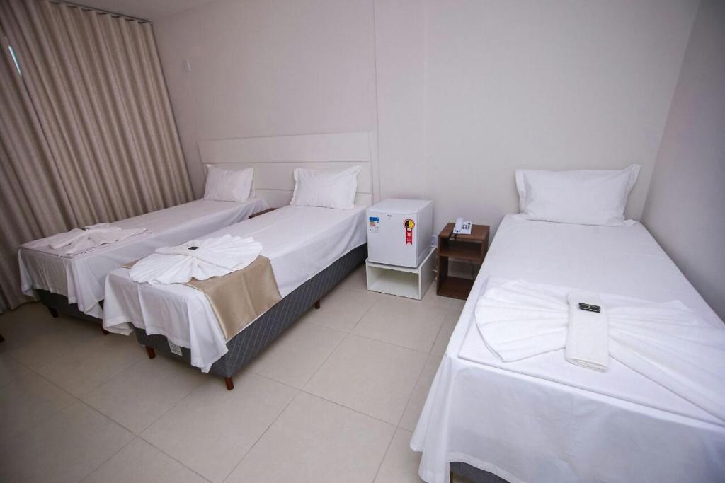 Postel nebo postele na pokoji v ubytování Hotel Portal Guanambi